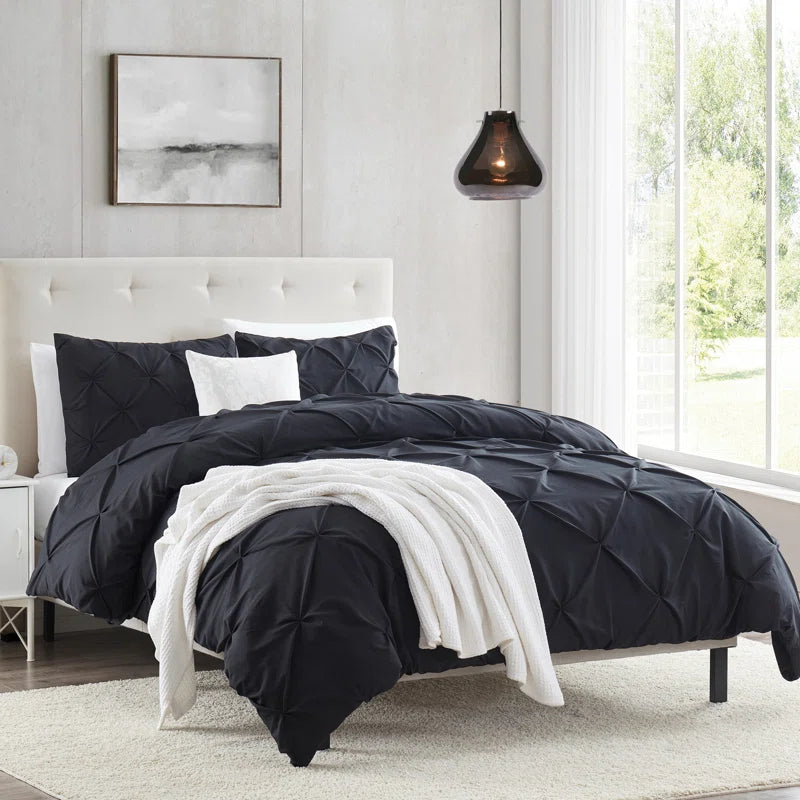 Goose down comforters known for their superior quality and insulationPintuck Comforter - Black