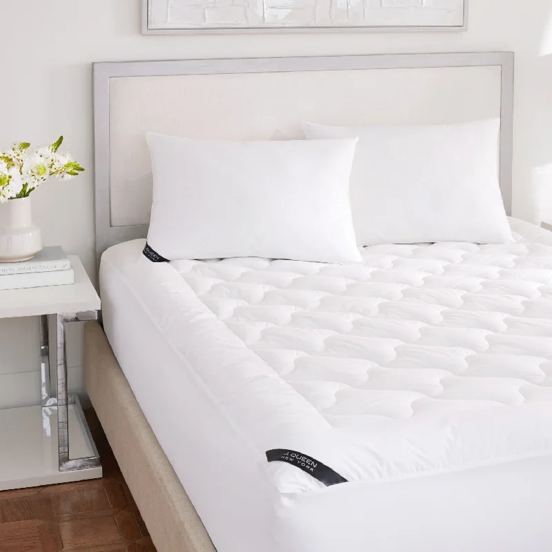 Down - filled comforters for supreme warmth and lightnessRoyalty Mattress Pad